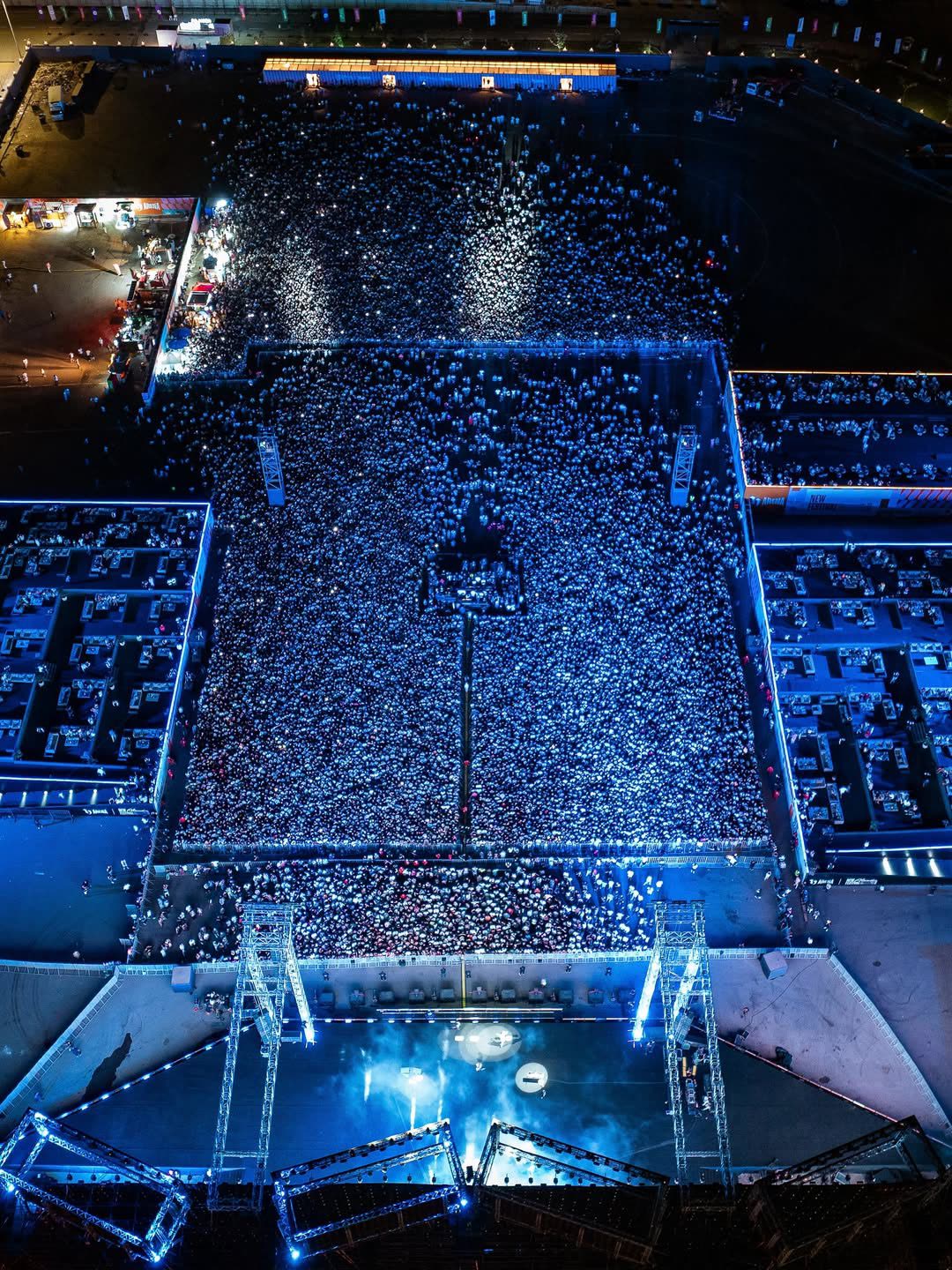 Aerial view of Cairokee crowd with blue confetti