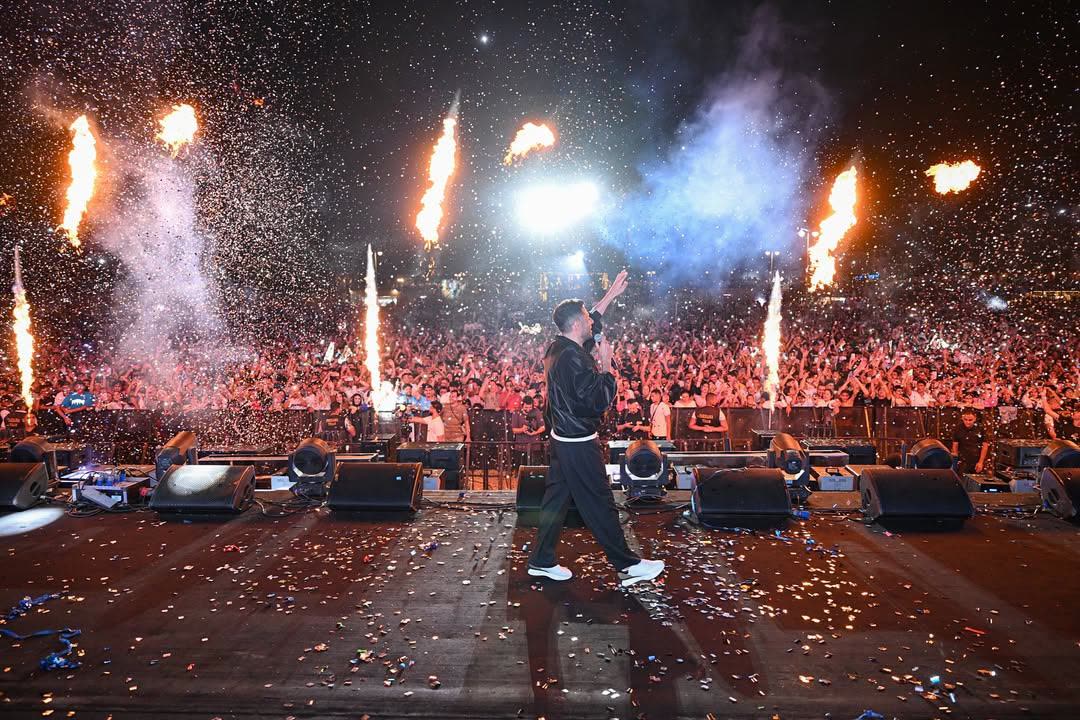Hamaki walking through confetti and pyro