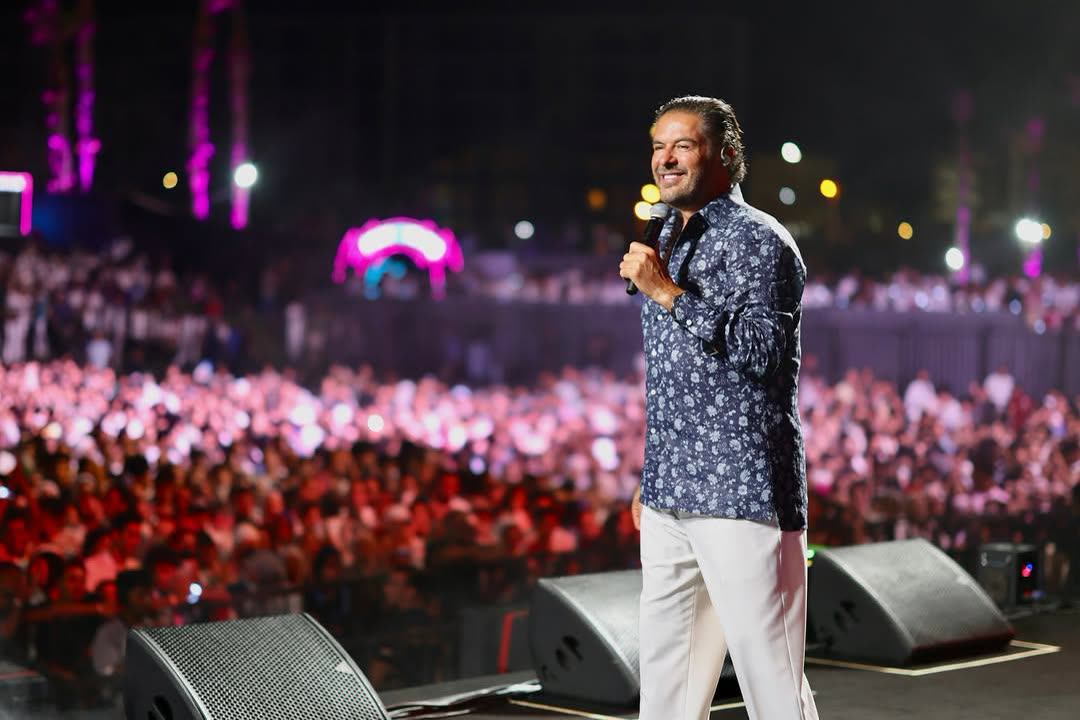 Ragheb Alama smiling on stage